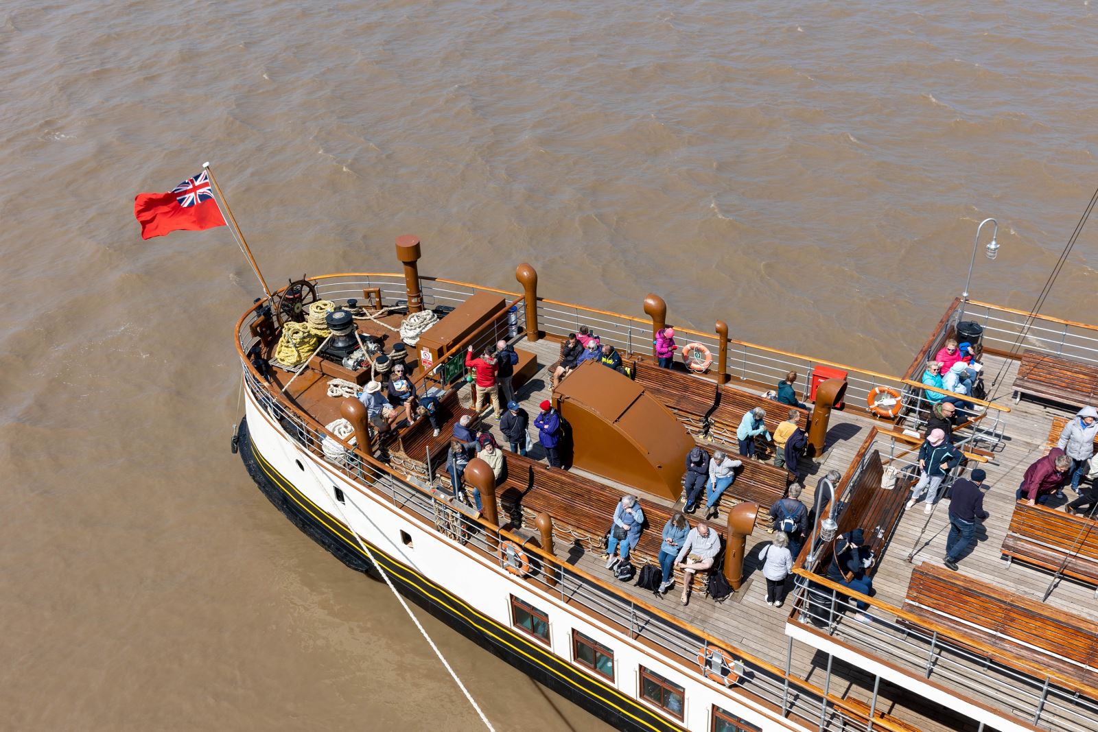 Aerial view looking down on the busy deck of the Waverley paddle steamer at sea